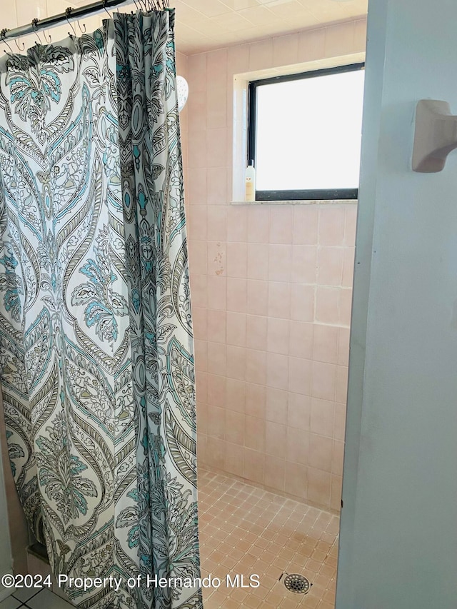 bathroom with a shower with shower curtain