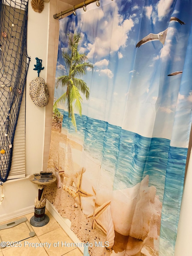 bathroom with tile patterned floors and a shower with curtain