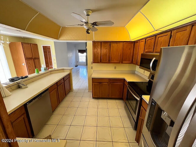 kitchen featuring ceiling fan and stainless steel appliances