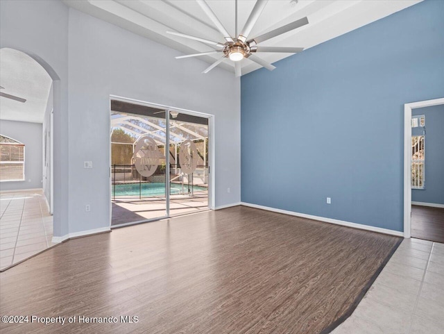 spare room with ceiling fan and wood-type flooring