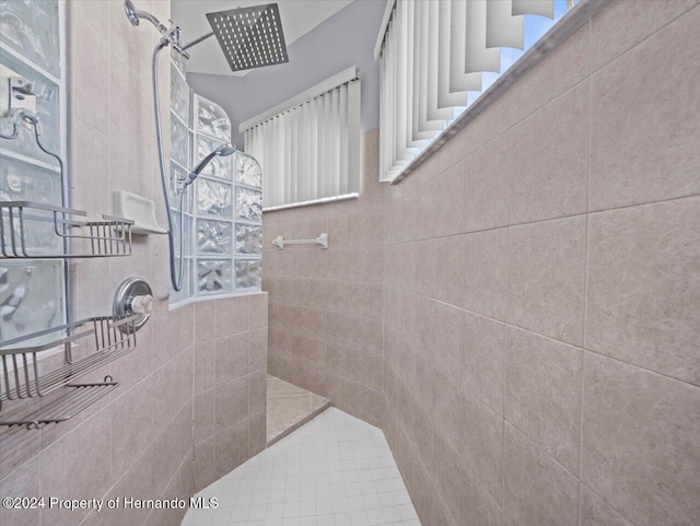 bathroom with tiled shower