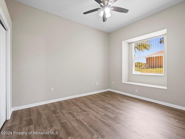 unfurnished room with ceiling fan and hardwood / wood-style floors