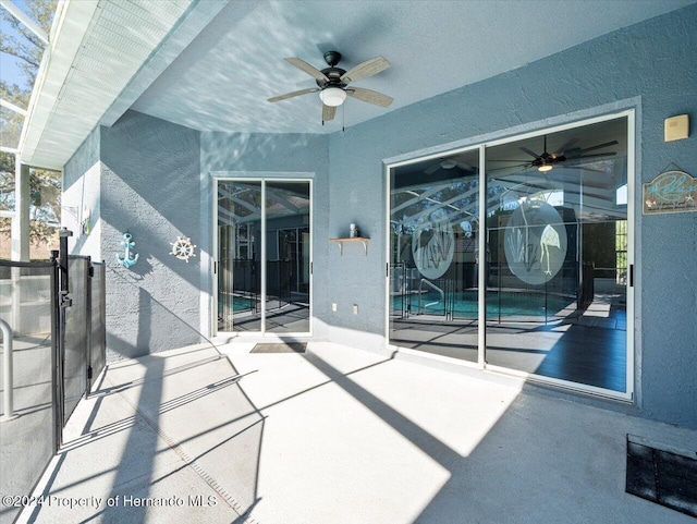 view of patio featuring ceiling fan