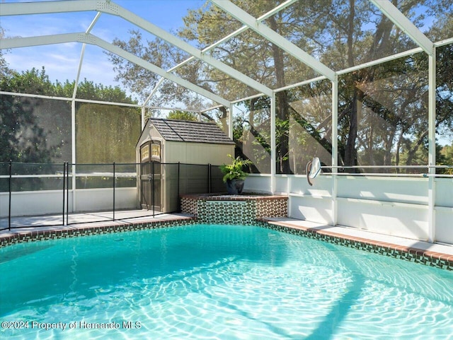 view of pool with glass enclosure