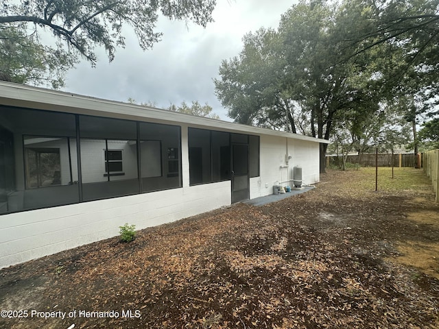 view of side of property with a sunroom