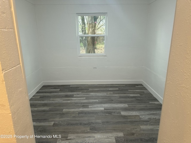 spare room with dark hardwood / wood-style floors