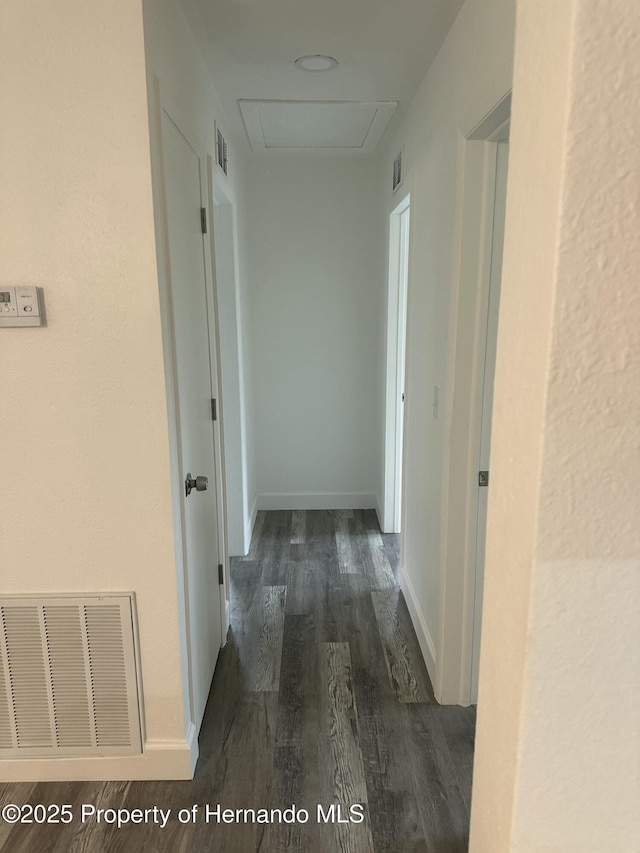 corridor featuring dark hardwood / wood-style flooring