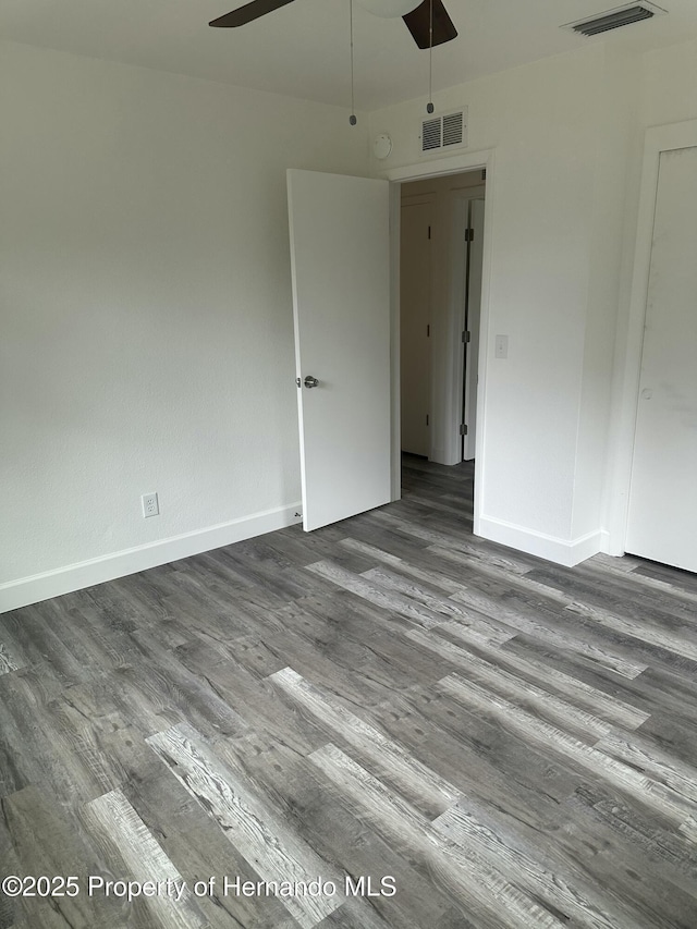 unfurnished room featuring hardwood / wood-style flooring and ceiling fan