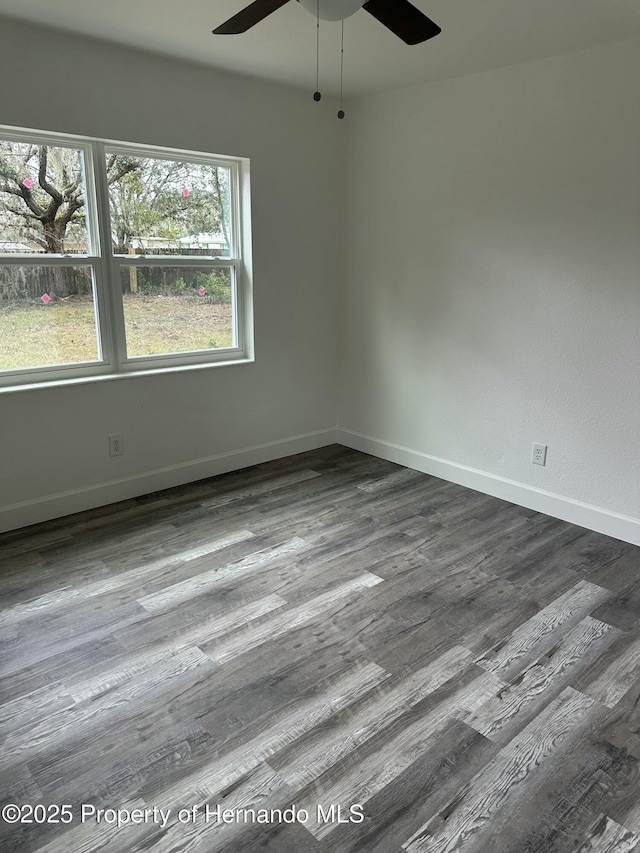 unfurnished room with ceiling fan and wood-type flooring