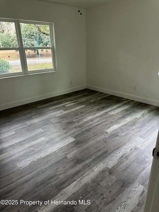 spare room with hardwood / wood-style flooring