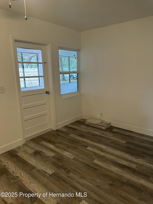 doorway to outside with dark hardwood / wood-style floors and plenty of natural light