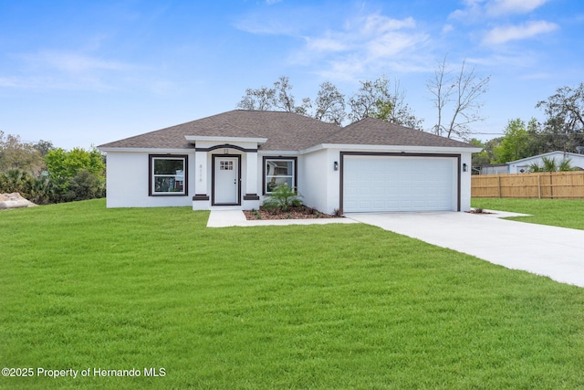 view of front of property with a garage, fence, concrete driveway, stucco siding, and a front lawn