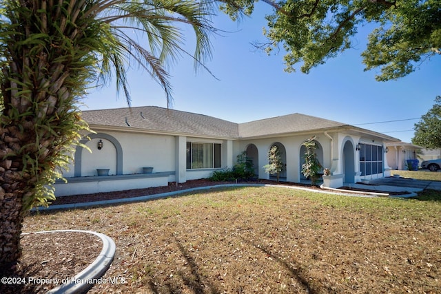 single story home with a front yard