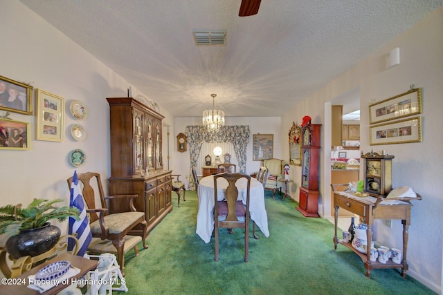 dining area with a chandelier, a textured ceiling, and dark carpet