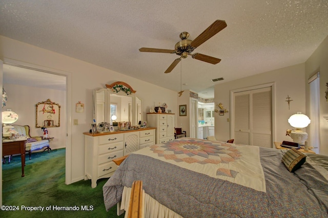 carpeted bedroom with a textured ceiling, a closet, and ceiling fan