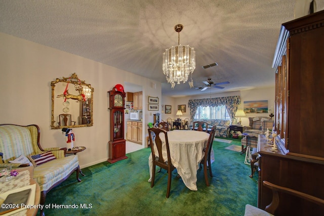 dining room with dark colored carpet, a textured ceiling, and ceiling fan with notable chandelier