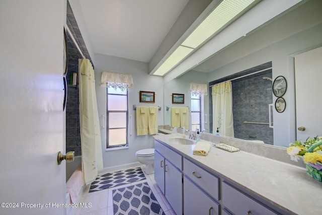 bathroom with tile patterned flooring, vanity, toilet, and walk in shower