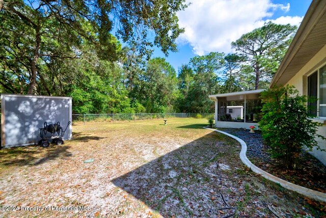 view of yard with a sunroom