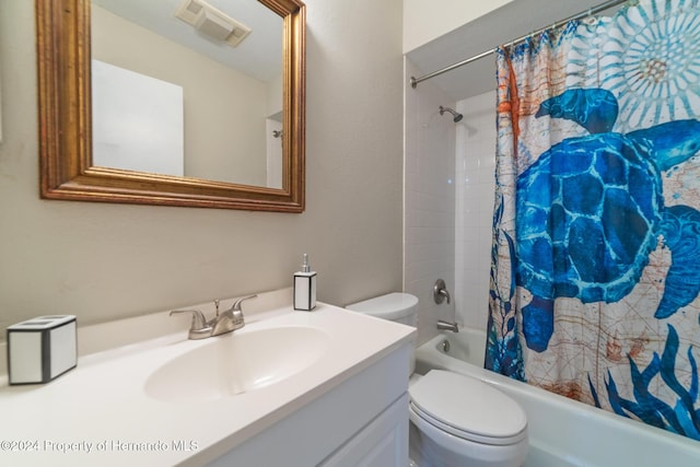 full bathroom with shower / bath combo, toilet, and vanity