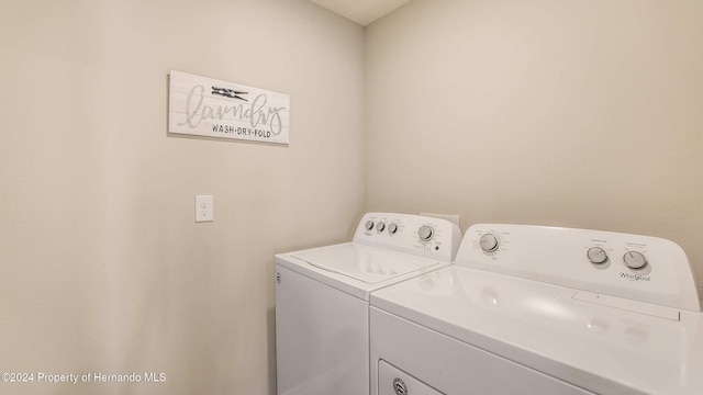 washroom with separate washer and dryer