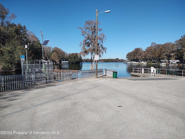 dock area with a water view