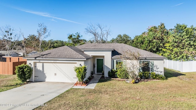 single story home with a garage and a front lawn