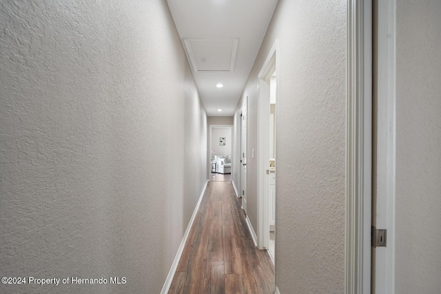 hall with dark hardwood / wood-style floors