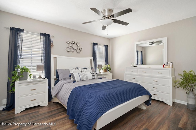 bedroom featuring ceiling fan and dark wood-type flooring