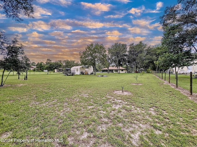 view of yard at dusk