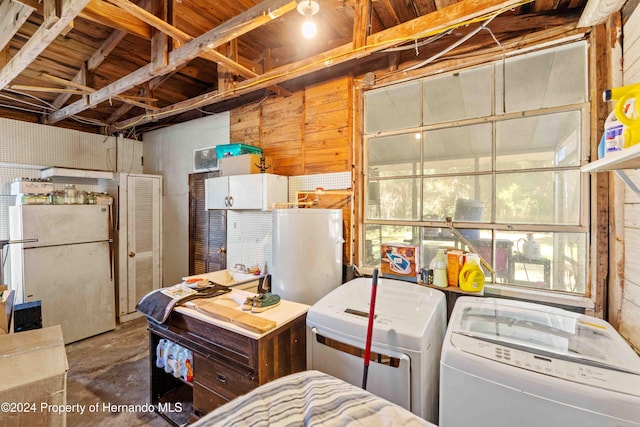 interior space with washing machine and clothes dryer, fridge, and white refrigerator