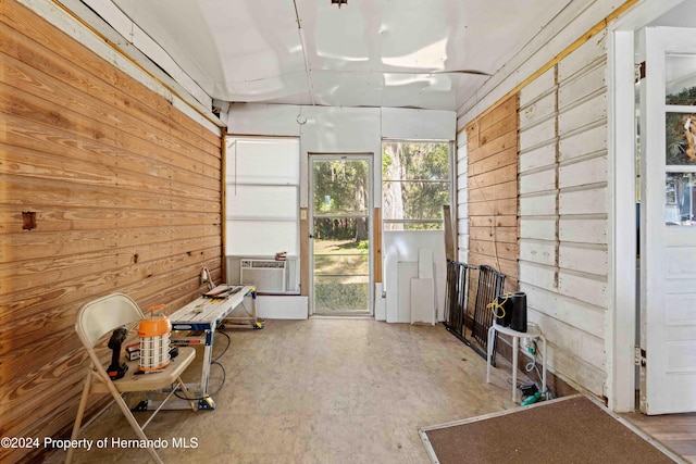 miscellaneous room featuring cooling unit and wooden walls