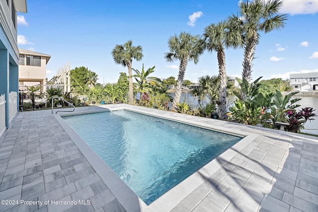 view of swimming pool with a patio