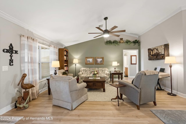 living room with ceiling fan, light wood-type flooring, ornamental molding, and vaulted ceiling