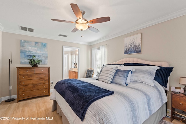 bedroom with ceiling fan, light wood-type flooring, ornamental molding, and connected bathroom