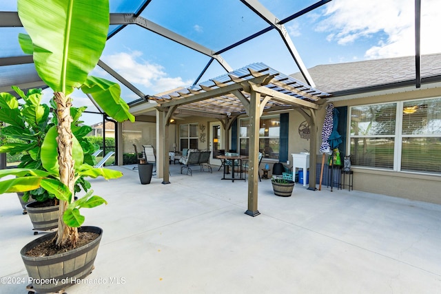 view of patio / terrace with a lanai and a pergola