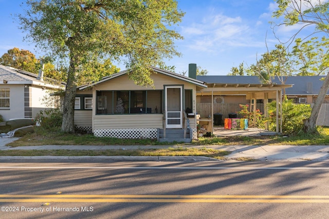 ranch-style home with a sunroom