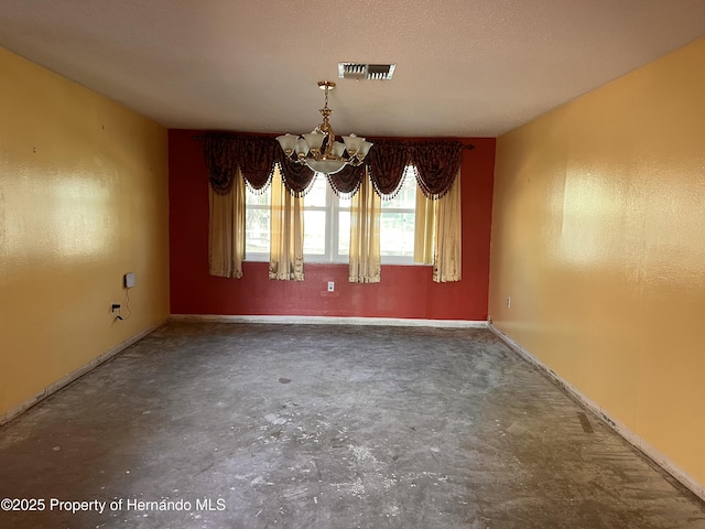 unfurnished dining area with a textured ceiling and a notable chandelier