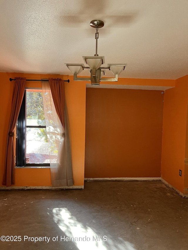 empty room with a textured ceiling