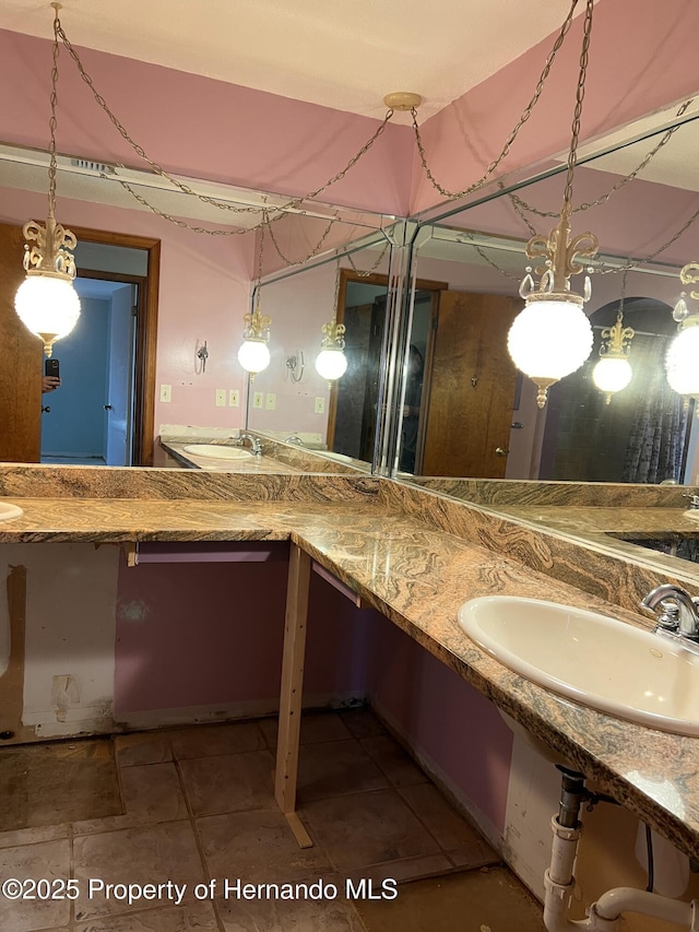 bathroom with sink and tile patterned floors