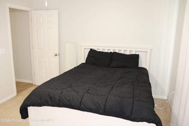 bedroom with light colored carpet