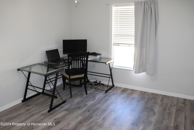 office with wood-type flooring