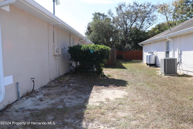 view of yard with central AC