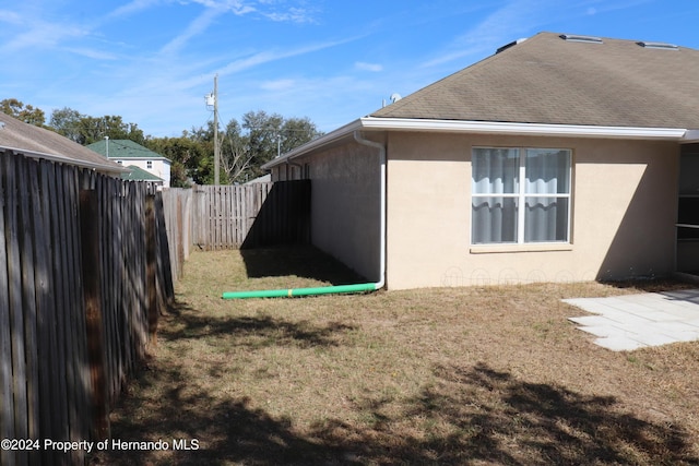 view of home's exterior with a yard