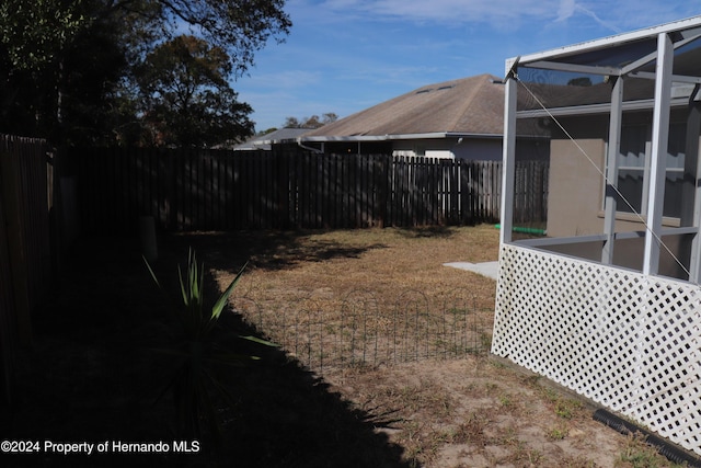 view of yard with a lanai