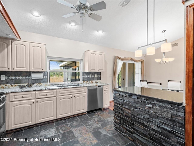 kitchen featuring backsplash, sink, ceiling fan, appliances with stainless steel finishes, and decorative light fixtures