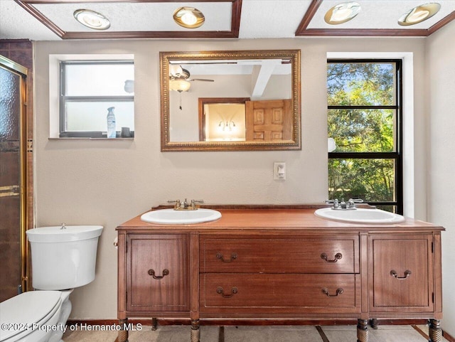 bathroom featuring an enclosed shower, a textured ceiling, vanity, ceiling fan, and toilet