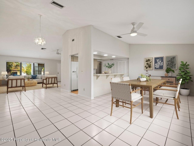 tiled dining space with ceiling fan with notable chandelier and vaulted ceiling