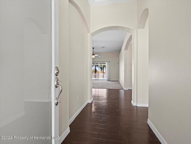 hall with dark hardwood / wood-style flooring