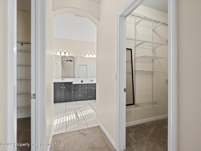 bathroom featuring tile patterned flooring and vanity