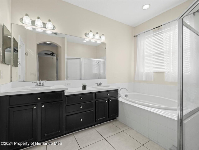 bathroom featuring tile patterned floors, vanity, ceiling fan, and plus walk in shower